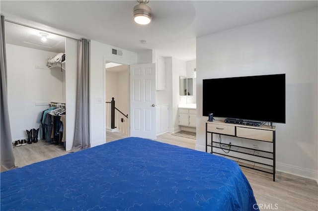 28215 Paseo El Siena Unit 46, Laguna Niguel, CA 92677 - bedroom with wood finished floors, ensuite bathroom, a spacious closet, a closet, and a ceiling fan