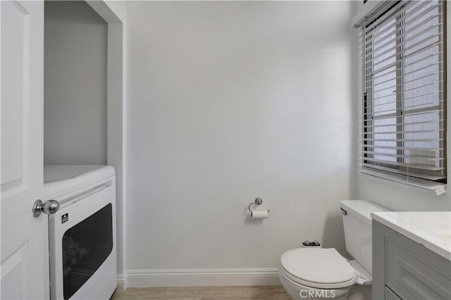 28215 Paseo El Siena Unit 46, Laguna Niguel, CA 92677 - half bath featuring healthy amount of natural light, vanity, and washer / dryer