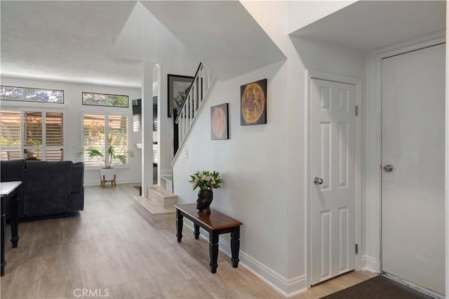 28215 Paseo El Siena Unit 46, Laguna Niguel, CA 92677 - hall with light wood-type flooring and stairway