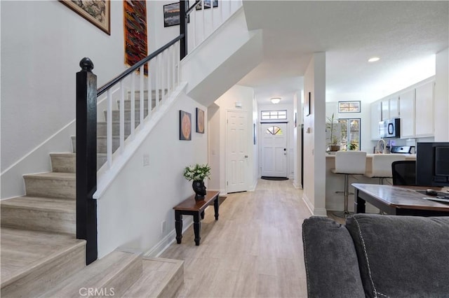 28215 Paseo El Siena Unit 46, Laguna Niguel, CA 92677 - stairs featuring wood finished floors and baseboards
