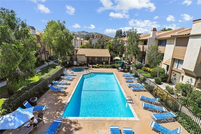 26322 W Bravo Ln, Calabasas, CA 91302 - community pool with a residential view, a patio, and a hot tub