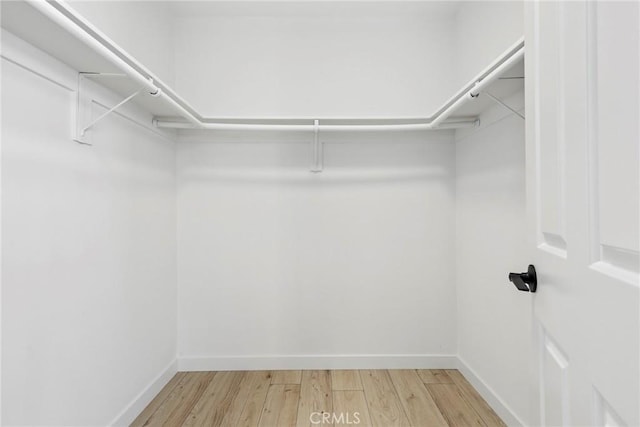 26322 W Bravo Ln, Calabasas, CA 91302 - walk in closet featuring light wood-type flooring