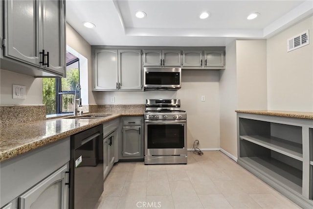 26322 W Bravo Ln, Calabasas, CA 91302 - kitchen with appliances with stainless steel finishes, a sink, gray cabinets, a tray ceiling, and recessed lighting