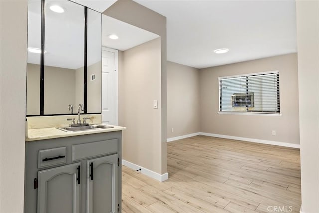 26322 W Bravo Ln, Calabasas, CA 91302 - bathroom with baseboards, vanity, and wood finished floors