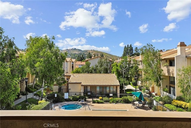 26322 W Bravo Ln, Calabasas, CA 91302 - back of property featuring stucco siding, a residential view, a tiled roof, and a mountain view