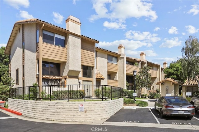 26322 W Bravo Ln, Calabasas, CA 91302 - view of property featuring uncovered parking