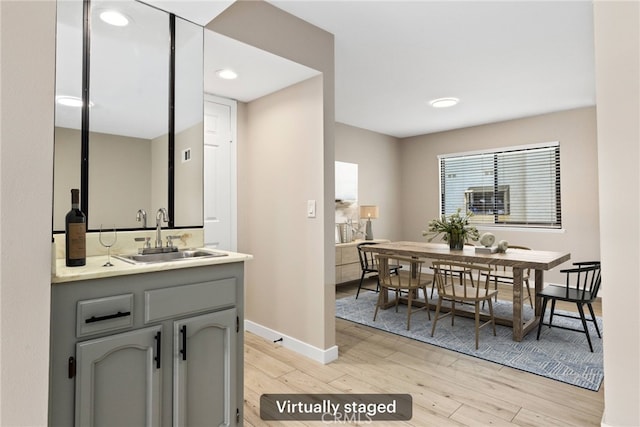 26322 W Bravo Ln, Calabasas, CA 91302 - bathroom with wood finished floors, vanity, and baseboards