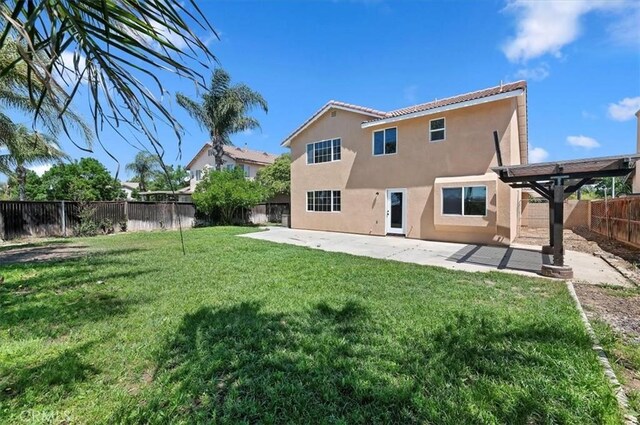 27541 Vanilla Ct, Menifee, CA 92585 - back of house with stucco siding, a patio, and a tiled roof