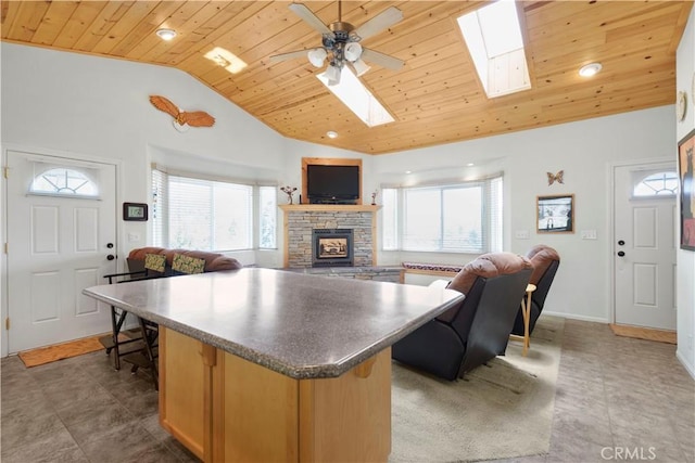 2340 Deep Creek Dr, Running Springs, CA 92382 - kitchen featuring wooden ceiling, vaulted ceiling, a fireplace, open floor plan, and a skylight