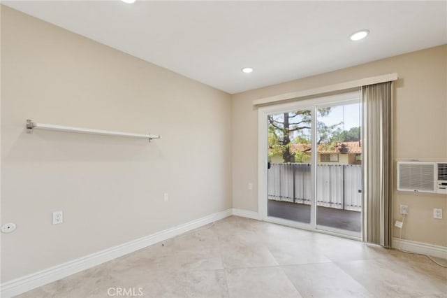 879 Via Mendoza Unit B, Laguna Woods, CA 92637 - unfurnished room featuring recessed lighting, an AC wall unit, baseboards, and light tile patterned floors