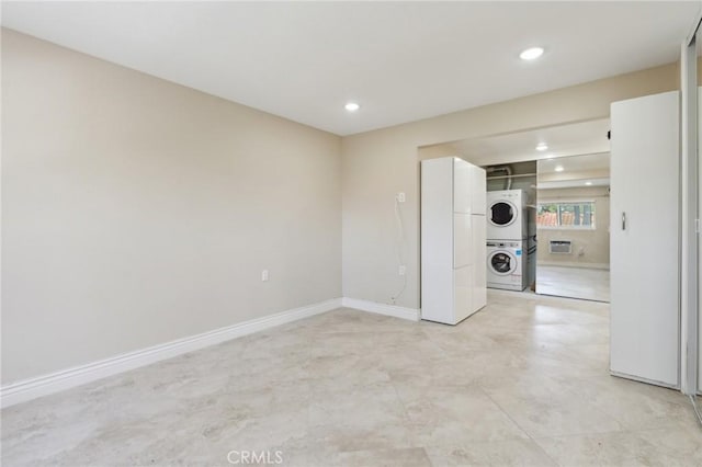 879 Via Mendoza Unit B, Laguna Woods, CA 92637 - washroom with stacked washing machine and dryer, recessed lighting, and baseboards