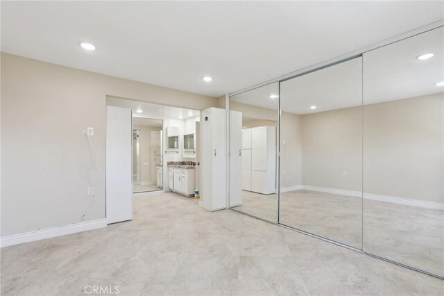 879 Via Mendoza Unit B, Laguna Woods, CA 92637 - unfurnished bedroom with recessed lighting, ensuite bath, baseboards, and a closet