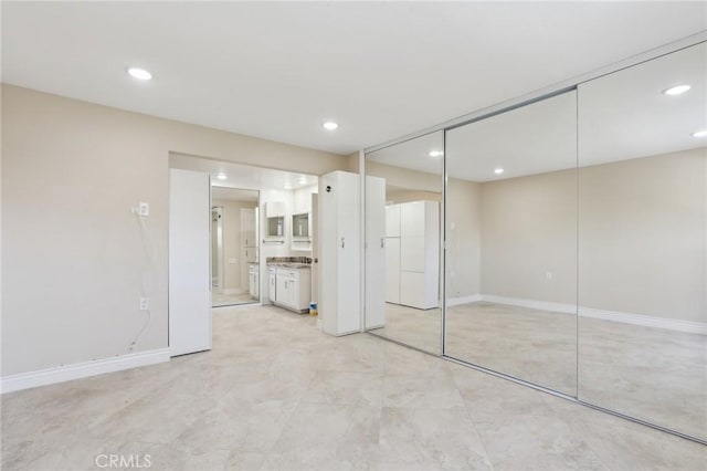 879 Via Mendoza Unit B, Laguna Woods, CA 92637 - unfurnished bedroom featuring recessed lighting, connected bathroom, and a closet