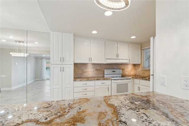 879 Via Mendoza Unit B, Laguna Woods, CA 92637 - kitchen with white appliances, under cabinet range hood, white cabinets, decorative backsplash, and recessed lighting