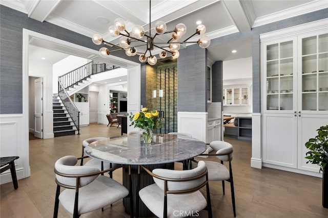 3914 Woodfield Dr, Sherman Oaks, CA 91403 - dining space with coffered ceiling, wood finished floors, a decorative wall, a chandelier, and beamed ceiling