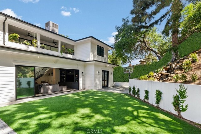 3914 Woodfield Dr, Sherman Oaks, CA 91403 - back of property with a ceiling fan, a balcony, a yard, stairway, and a patio area