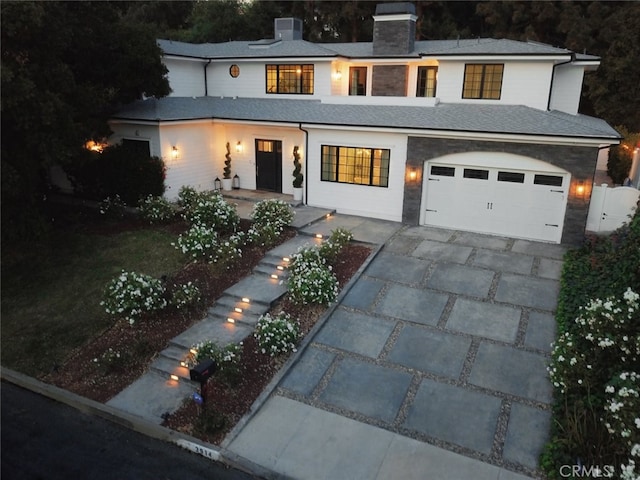 3914 Woodfield Dr, Sherman Oaks, CA 91403 - view of front of property featuring concrete driveway, a chimney, and an attached garage