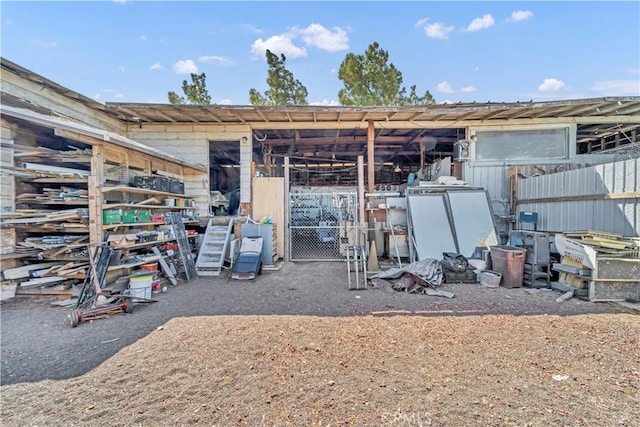 26447 20 Mule Team Rd, Boron, CA 93516 - back of property featuring an exterior structure and an outbuilding
