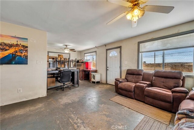 26447 20 Mule Team Rd, Boron, CA 93516 - living area featuring an office area, concrete floors, and a ceiling fan
