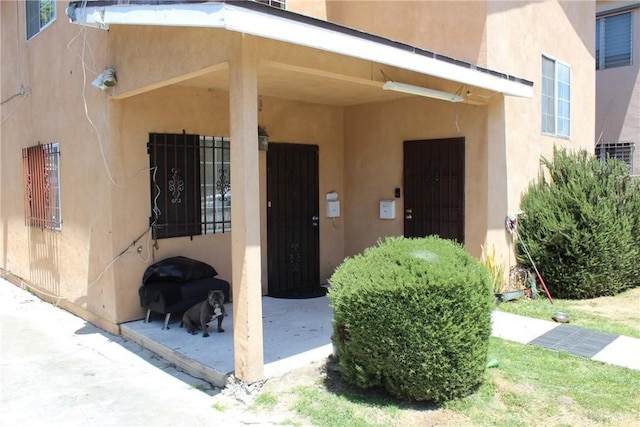 127 E 95th St, Los Angeles, CA 90003 - view of exterior entry featuring stucco siding