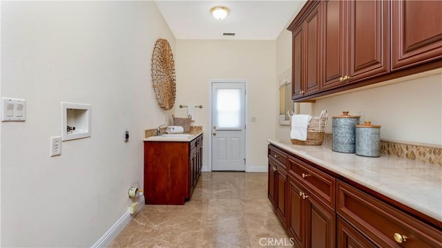 2225 Wind River Ln, Rowland Heights, CA 91748 - laundry area with cabinet space, baseboards, and hookup for a washing machine