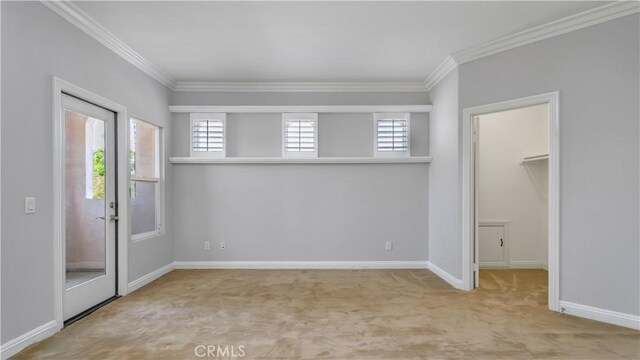 2225 Wind River Ln, Rowland Heights, CA 91748 - unfurnished bedroom featuring carpet, crown molding, a spacious closet, multiple windows, and baseboards