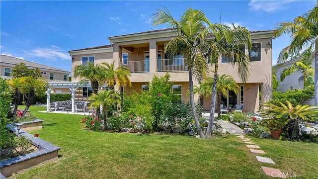 2225 Wind River Ln, Rowland Heights, CA 91748 - back of property featuring stucco siding, a pergola, a lawn, a balcony, and a patio area