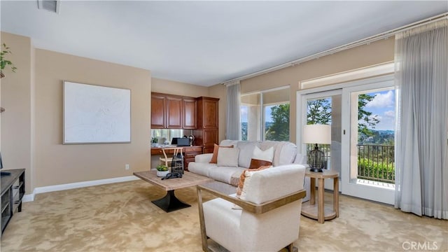 2225 Wind River Ln, Rowland Heights, CA 91748 - living area featuring light carpet, healthy amount of natural light, baseboards, and an office area