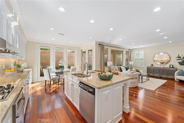 33 Lacebark, Irvine, CA 92618 - kitchen featuring appliances with stainless steel finishes, a sink, ornamental molding, white cabinets, and dark wood-style floors