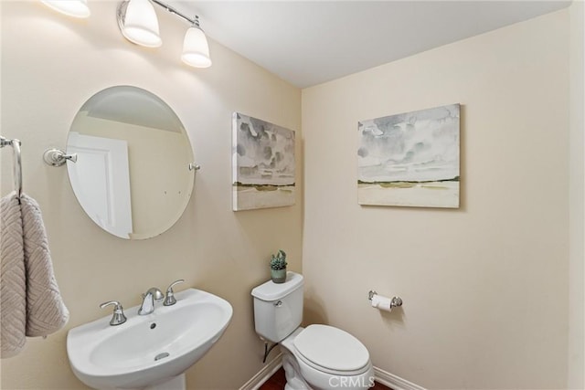 33 Lacebark, Irvine, CA 92618 - half bath featuring toilet, a sink, and baseboards