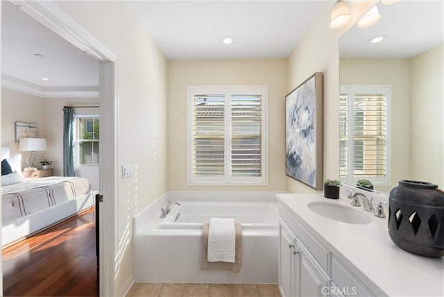 33 Lacebark, Irvine, CA 92618 - full bathroom with a garden tub, vanity, plenty of natural light, and recessed lighting