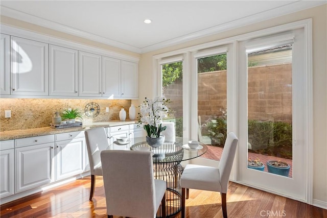 33 Lacebark, Irvine, CA 92618 - dining room with light wood finished floors, crown molding, and recessed lighting