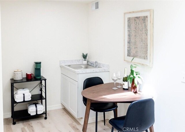 256 E 1st Ave, Chico, CA 95926 - dining room with light wood finished floors and baseboards