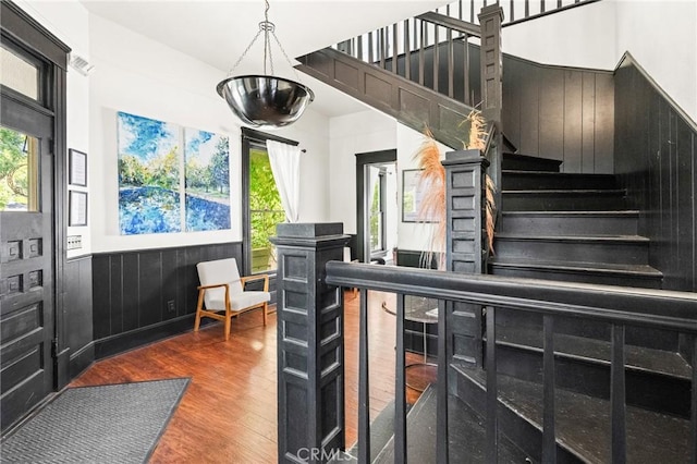 256 E 1st Ave, Chico, CA 95926 - entryway featuring wood finished floors, a wainscoted wall, and stairs