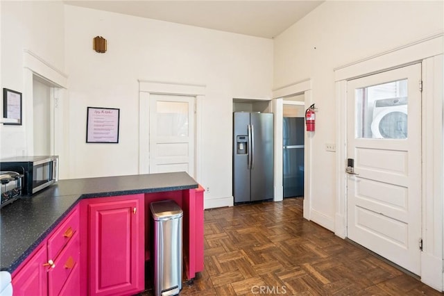 256 E 1st Ave, Chico, CA 95926 - kitchen with appliances with stainless steel finishes, dark countertops, and a peninsula