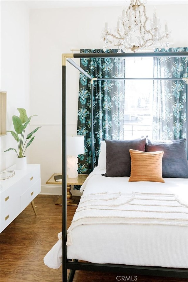 256 E 1st Ave, Chico, CA 95926 - bedroom with a chandelier and wood finished floors