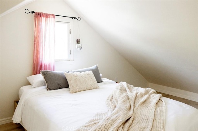256 E 1st Ave, Chico, CA 95926 - bedroom with lofted ceiling, baseboards, and wood finished floors