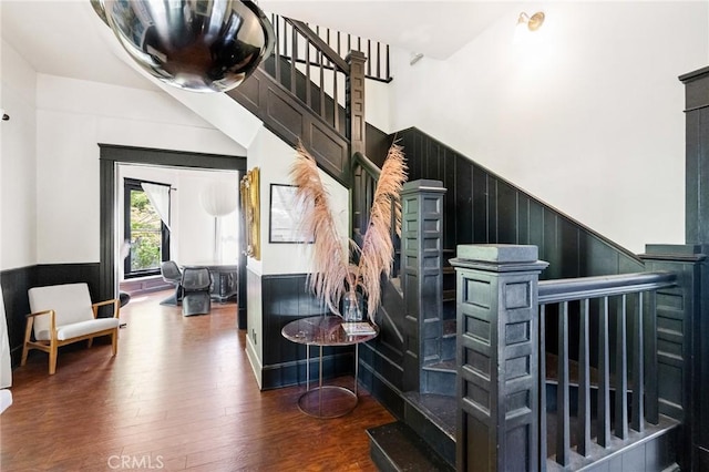 256 E 1st Ave, Chico, CA 95926 - staircase featuring a wainscoted wall, wood finished floors, and a high ceiling