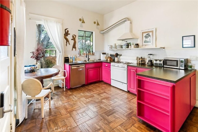 256 E 1st Ave, Chico, CA 95926 - kitchen featuring appliances with stainless steel finishes, open shelves, red cabinetry, and custom exhaust hood