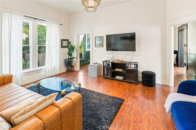 256 E 1st Ave, Chico, CA 95926 - living room featuring wood finished floors and a wainscoted wall