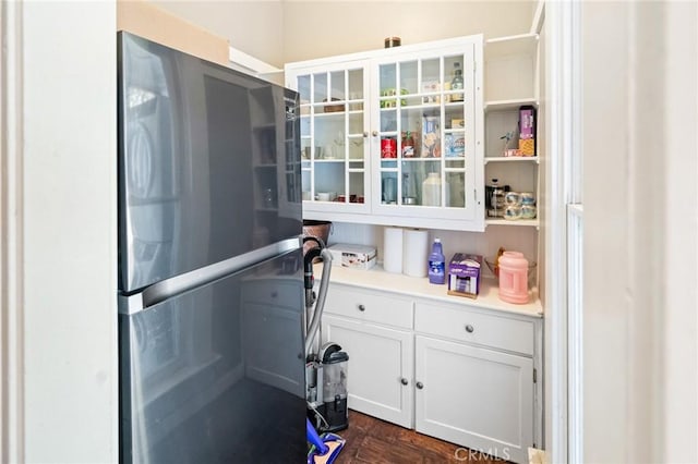 256 E 1st Ave, Chico, CA 95926 - kitchen featuring freestanding refrigerator, white cabinets, light countertops, and dark wood finished floors