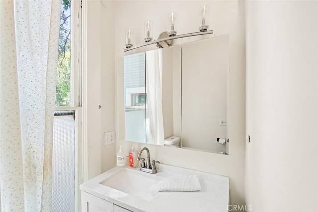 256 E 1st Ave, Chico, CA 95926 - bathroom featuring vanity and toilet