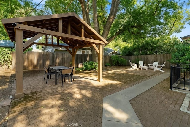 256 E 1st Ave, Chico, CA 95926 - fenced backyard with a gazebo, outdoor dining area, and a patio area