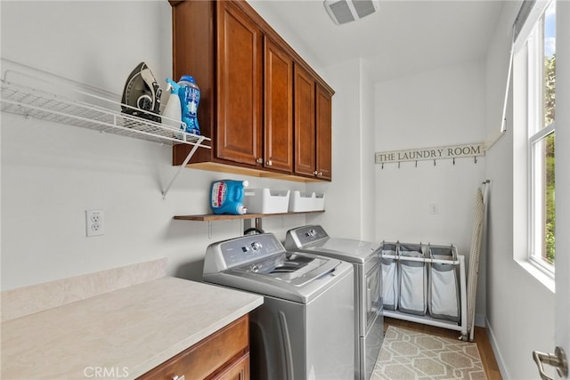 28321 Esplanada Dr, Valencia, CA 91354 - laundry area featuring washing machine and clothes dryer, cabinet space, light wood-style flooring, and baseboards