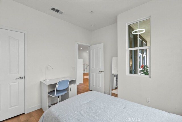 28321 Esplanada Dr, Valencia, CA 91354 - bedroom with wood finished floors and baseboards