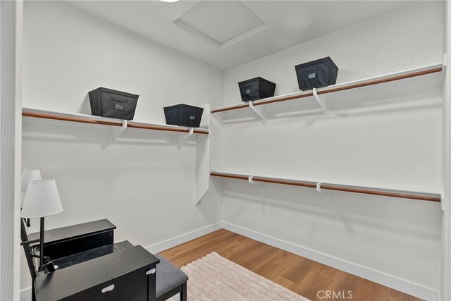 28321 Esplanada Dr, Valencia, CA 91354 - walk in closet with wood finished floors and attic access