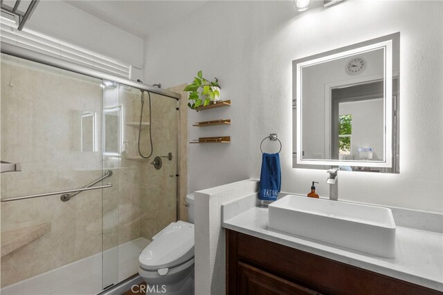 28321 Esplanada Dr, Valencia, CA 91354 - full bathroom featuring toilet, a shower stall, and vanity