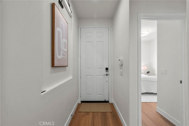 28321 Esplanada Dr, Valencia, CA 91354 - corridor with wood finished floors and baseboards