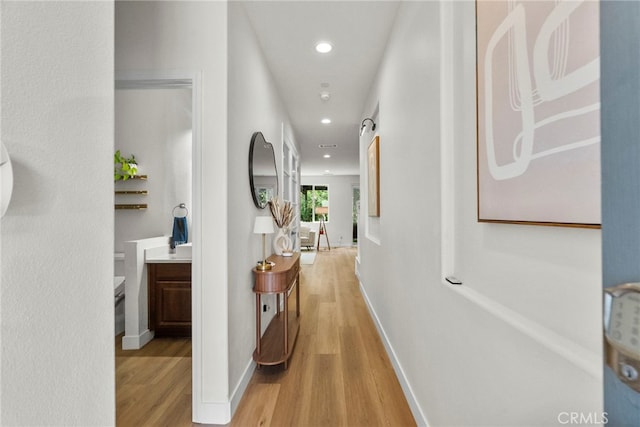 28321 Esplanada Dr, Valencia, CA 91354 - corridor with light wood finished floors, recessed lighting, and baseboards
