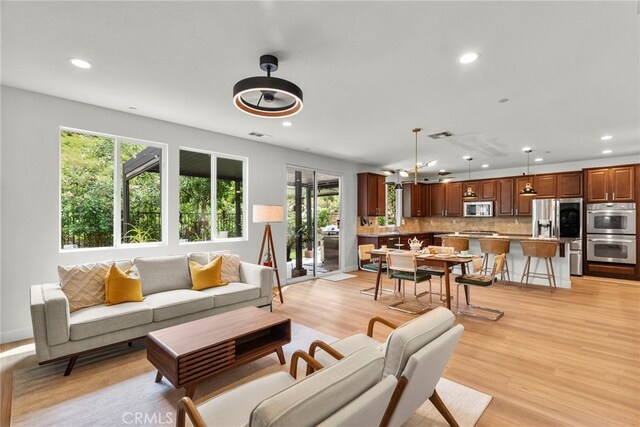 28321 Esplanada Dr, Valencia, CA 91354 - living room featuring plenty of natural light, recessed lighting, and light wood-type flooring